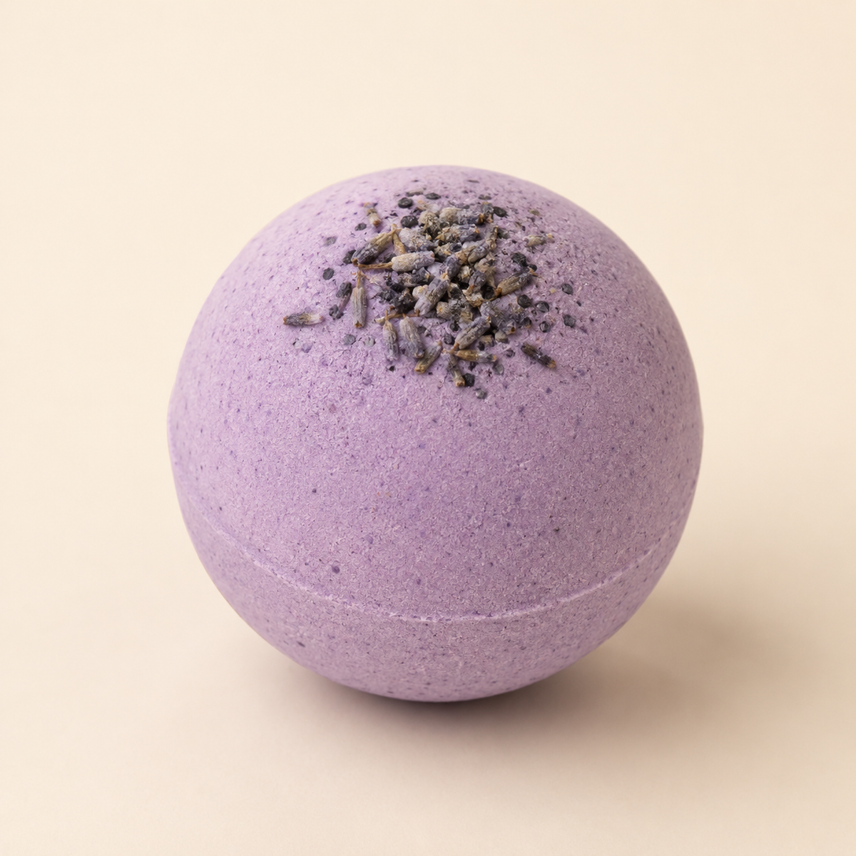 Lavender Recovery CBD bath bomb with dried lavender on ivory background