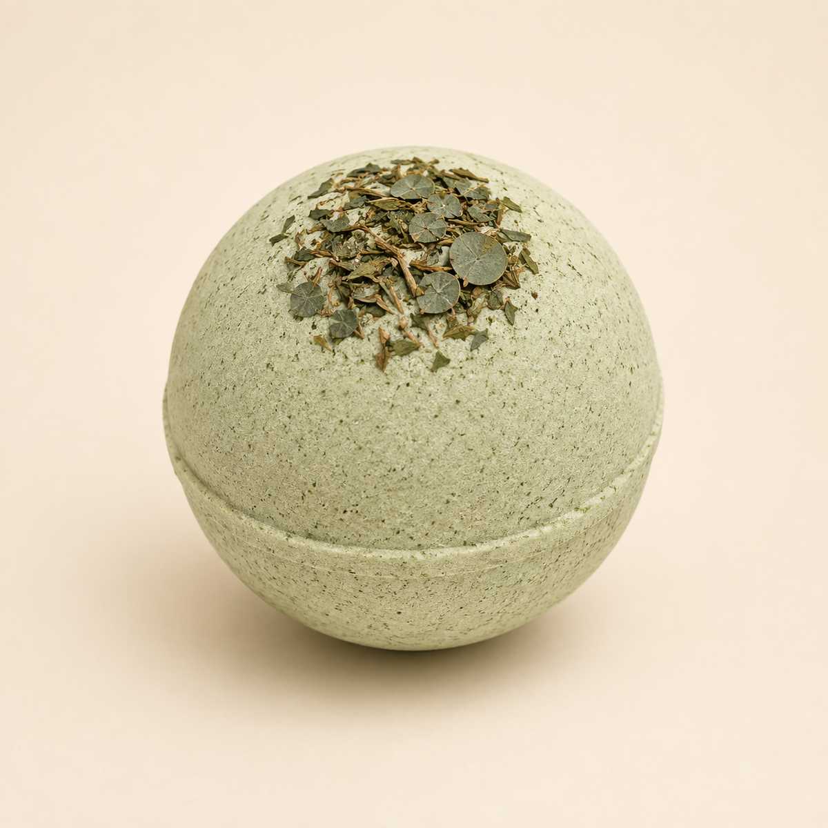 Mint Botanical Recovery CBD bath bomb with dried eucalyptus on ivory background